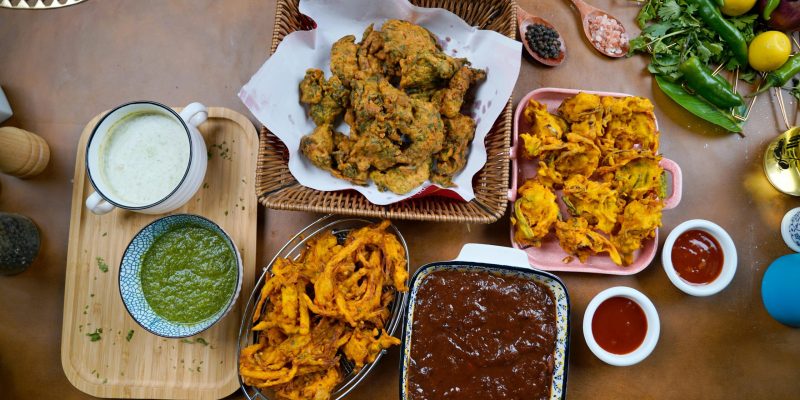 Traditional Desi Pakora with Mint and Green Sauces- Popular Pakistani Snack